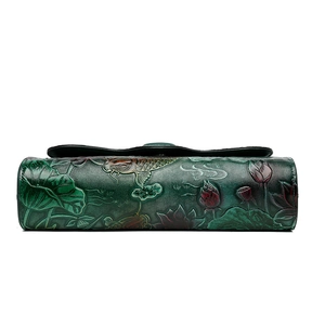 Ethnic embossed crossbody bag with lotus and koi pattern in dark green leather