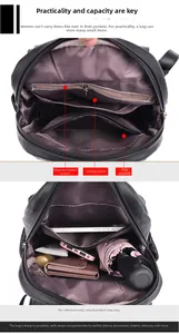 Detail view of large capacity black leather backpack with organized interior pockets