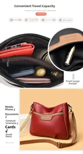 Detailed view of women's leather crossbody bag with multiple interior compartments
