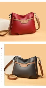 Detailed macro view of litchi texture leather and refined brown edge stitching on small bag