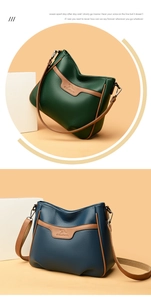 Detail of lychee textured leather handbags with kangaroo logo and contrast stitching