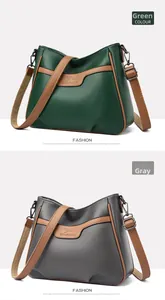 Detailed comparison of green and grey crossbody bags with litchi grain and metal logos