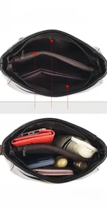 Detail of black crossbody bag interior with zipper pockets and large storage capacity