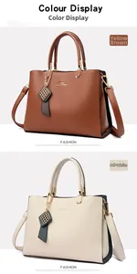 Gros plan de sacs à main en cuir grainé jaune brun et blanc crème avec détails dorés