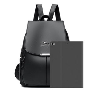 Large black leather backpack with lychee texture and kangaroo logo shown with tablet