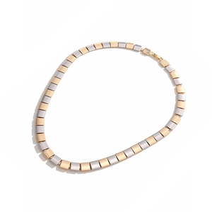 Flat necklace with alternating gold and silver square links and secure lobster clasp