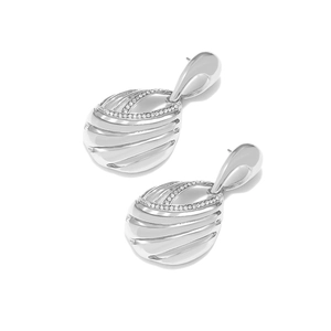 Detail of silver hollow drop earrings with rhinestone inlay and sleek metallic finish