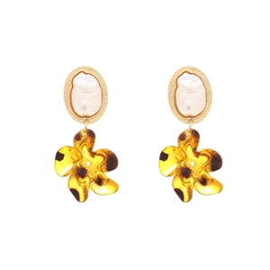 Baroque faux pearl earrings with leopard print flower pendants on a white background