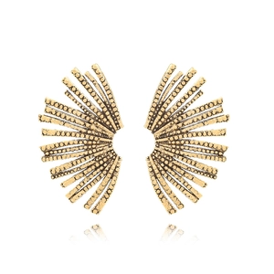 Detailed view of gold leaf earrings with intricate textured radial patterns and vintage finish