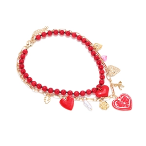 Layered double-strand necklace with red beads, gold charms, and enamel heart pendants
