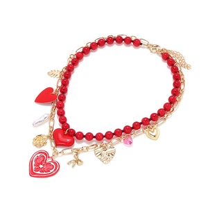 Double-layered necklace with red beads, golden chains and multi-heart leaf pendants