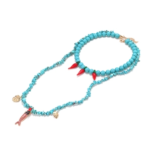 Double-layer turquoise bead necklace with red chili pendant and golden shell charms
