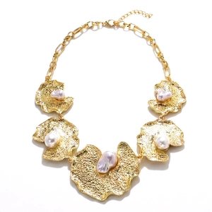 Vintage baroque necklace featuring gold hammered irregular pendants with natural pearls