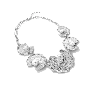 Modern irregular silver alloy leaf necklace with textured hammered finish and faux pearls