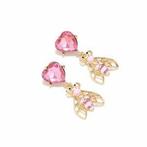 Detail of bee drop earrings with pink faceted heart crystal and gold insect pendant
