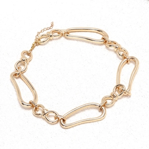 Detail of chunky gold geometric hollow link chain necklace with polished finish