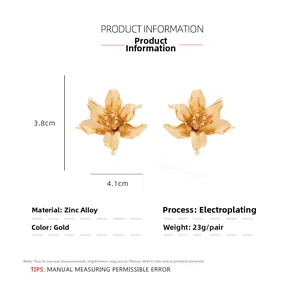 Detail of 3.8x4.1cm gold flower earrings with layered petals and zinc alloy texture
