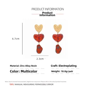 Detailed size chart showing 6.7cm heart-shaped leopard print resin drop earrings