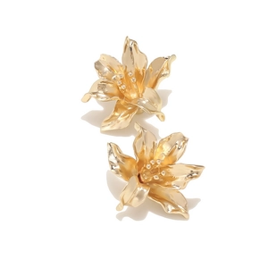 Luxurious gold vintage oversized floral earrings with 3D lily petal design on white background