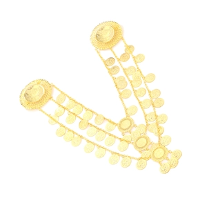 Close-up of golden multi-layer chain brooch with detailed embossed coin pendants