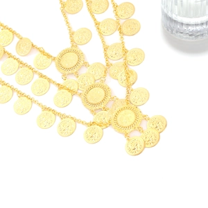 Luxurious multi-layer gold coin waterfall brooch featuring embossed vintage coin charms