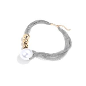 Elegant mesh necklace with large pearl and gold beads on a minimalist white background