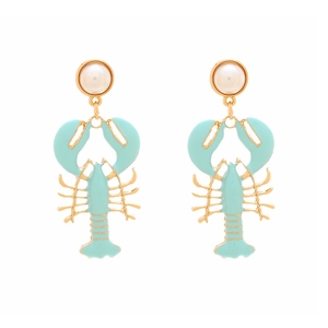 Close-up of enamel lobster drop earrings with gold accents and faux pearl studs