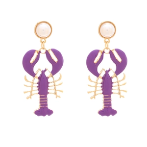 Detail of purple lobster earrings with gold metal frame and white pearl accents