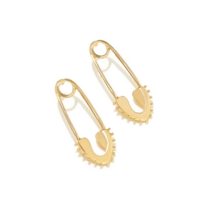 Detail of golden safety pin earrings with hollow heart shape and beaded texture finish