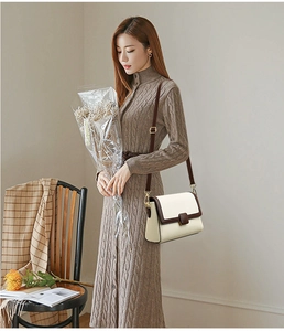 Detail of retro flap square bag in cream lychee grain leather with brown accents