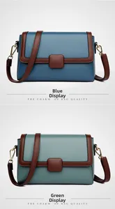 Detailed view of dual-color flap crossbody bags in blue and green pebble leather