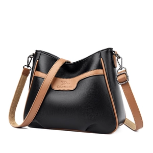 Women's color-block crossbody square bag in black and brown pebble leather with strap