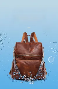 Waterproof test on brown leather backpack with colorful bohemian strap and bubble effects