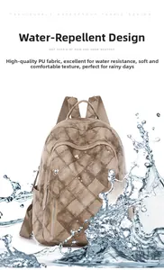 Close-up of waterproof brown quilted PU leather backpack with sleek metal zipper details