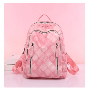 Front view of pink faux leather backpack with diamond texture and double zipper pockets