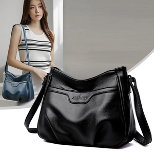 Chic embossed leather crossbody bag with adjustable strap and ruched pleated detail