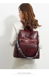 Detail of burgundy PU leather backpack with bohemian print wide shoulder strap