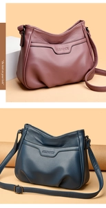 Detail view of purple and blue crossbody bags featuring premium embossed lychee texture