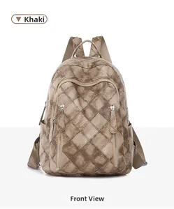 Front view of khaki PU leather backpack with quilted diamond texture and zip pockets