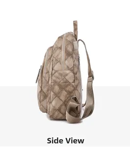 Side view of large quilted PU leather backpack showing multiple zipper compartments