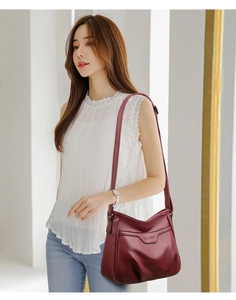 Chic burgundy embossed leather crossbody bag shown on model for daily style and size reference