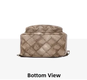 Detailed bottom view of the brown quilted PU leather backpack showing stitching quality