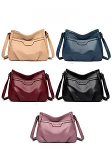 Detailed view of the textured faux leather shoulder bag available in five elegant colors