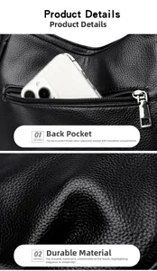 Detailed view of black litchi grain leather shoulder bag featuring a functional rear zip pocket