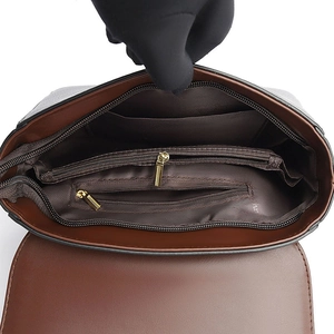 Internal structure of brown leather crossbody bag with multiple storage compartments