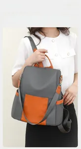 Detail view of contrast color stitching and premium fabric texture of the casual backpack