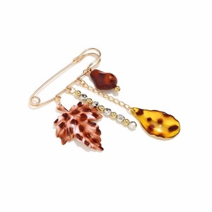 Broche épingle dorée avec pendentifs feuille léopard et gouttes pour un style vintage