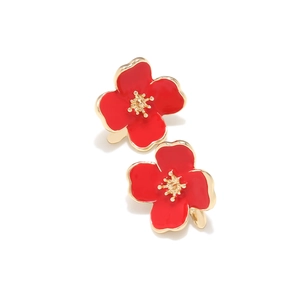 Detail of red enamel flower earrings with gold-toned alloy base and central pistils