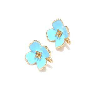 Detail of sky blue enamel flower earrings with golden petals and realistic floral center