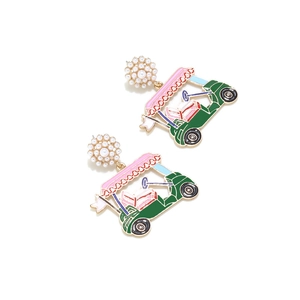 Detail shot of golf cart earrings with white imitation pearls and colorful enamel charms